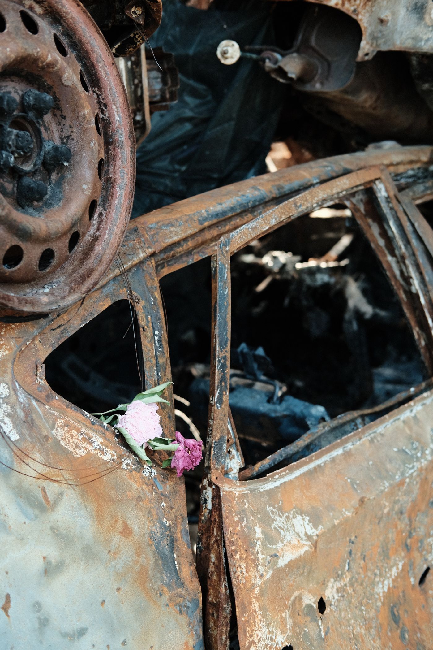 Close view of a weathered vehicle ready for material recovery